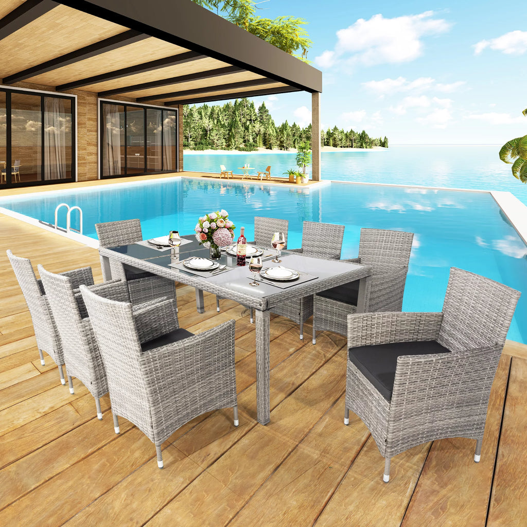 9 Pieces Wicker Outdoor Dining Set with Glass Tabletop and Cushioned Chairs I92990
