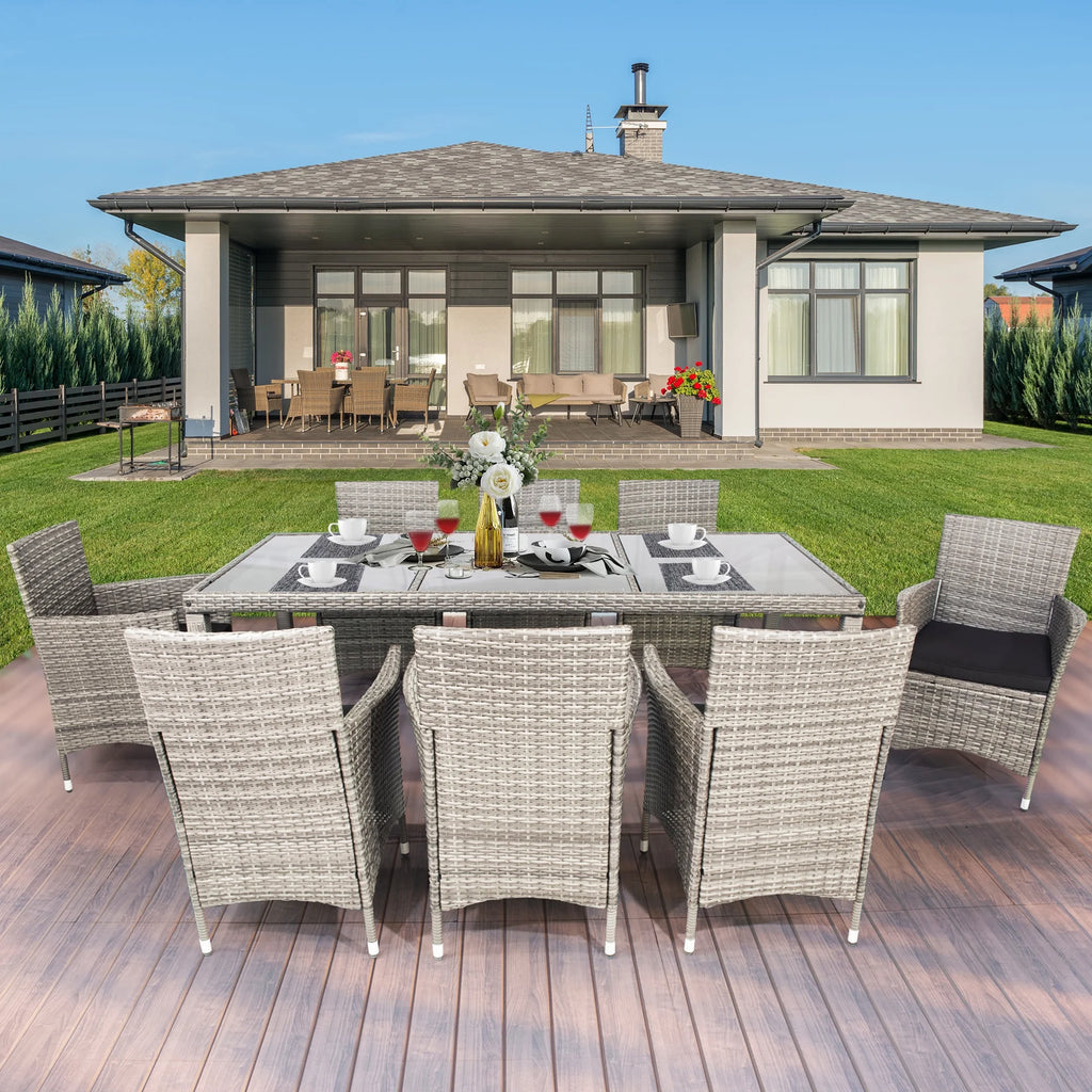 9 Pieces Wicker Outdoor Dining Set with Glass Tabletop and Cushioned Chairs I92990