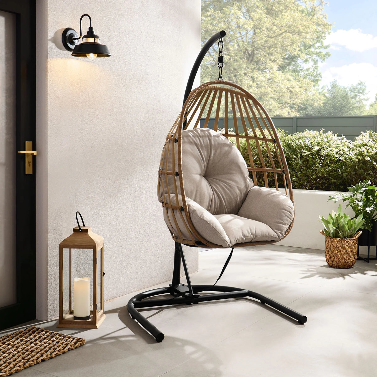 Wicker Outdoor Hanging Egg Chair with Beige Cushion and Black Metal Stand M167457